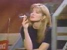 Crystal Bernard smoking a cigarette