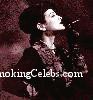 Daniela Cardone smoking a cigarette