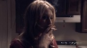 Sara Downing smoking a cigarette
