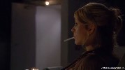 Jenna Elfman smoking a cigarette