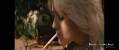 Dakota Fanning smoking a cigarette