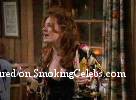 Joely Fisher smoking a cigarette