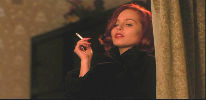 Tara Fitzgerald smoking a cigarette