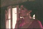Carla Gugino smoking a cigarette