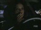 Annabeth Gish smoking a cigarette