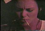 Melanie Hall smoking a cigarette
