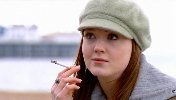 Olivia Hallinan smoking a cigarette