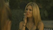 Rebekah Kochan smoking a cigarette